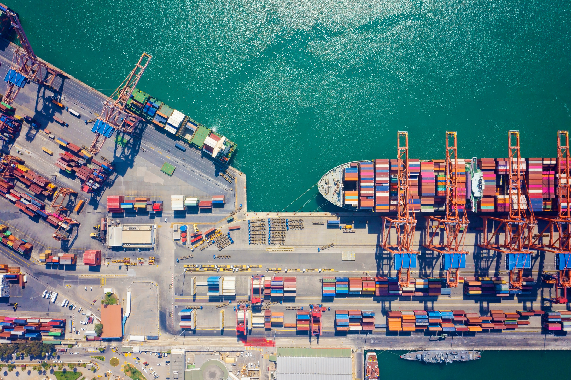 Aerial view cargo ship terminal, Unloading crane of cargo ship terminal.